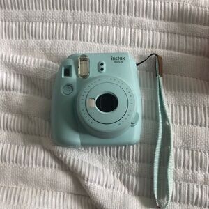 instax fuji film camera with wrist band